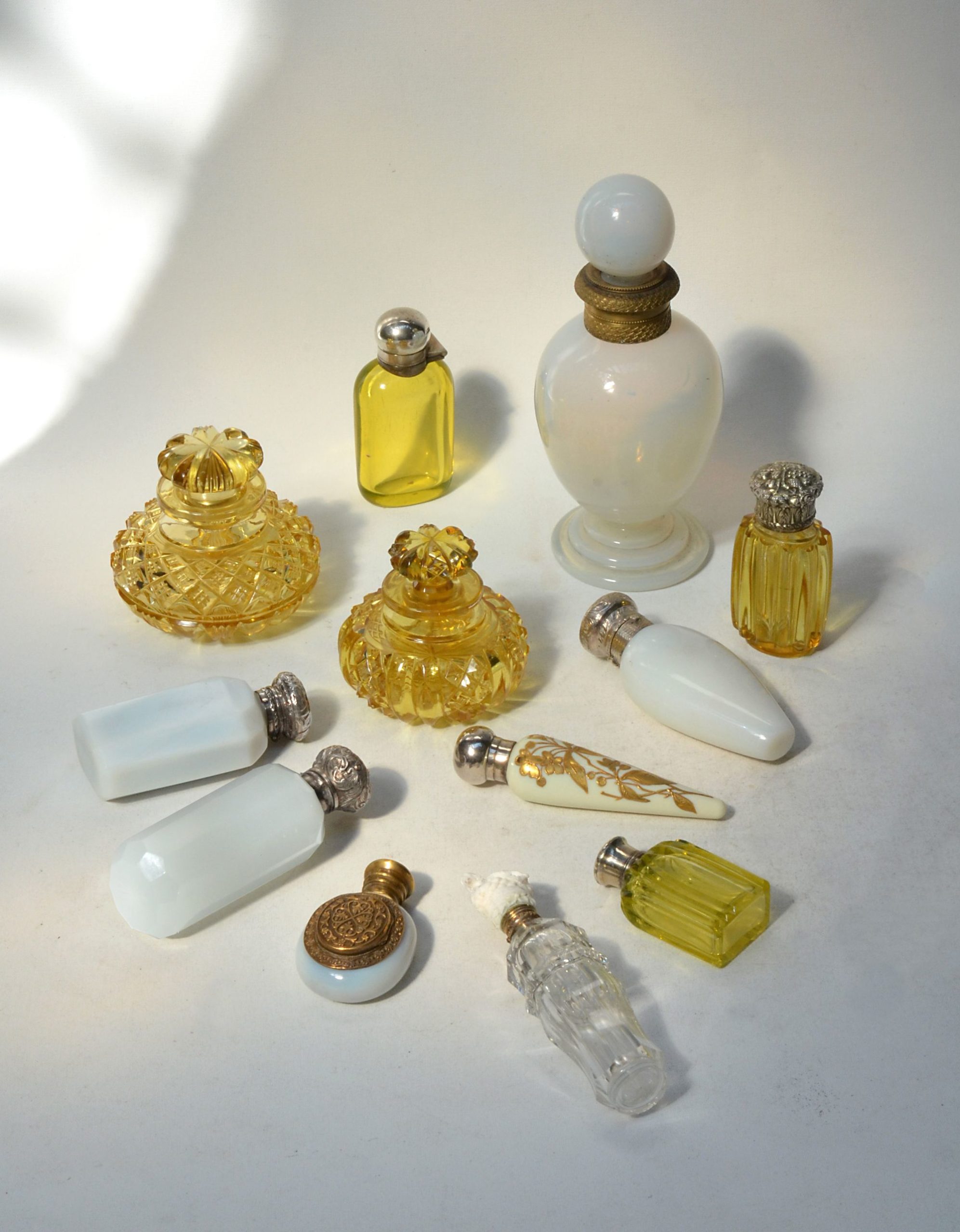 Collection of twelve lemon yellow and white opaline glass Scent bottles ...